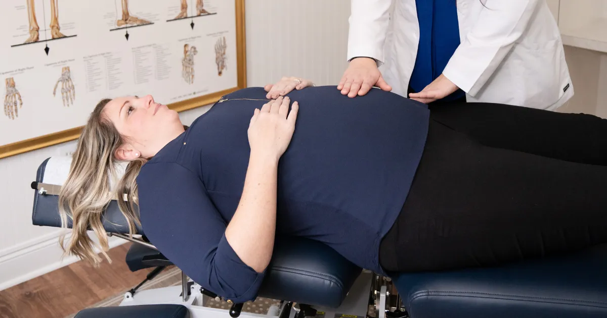 chiropractor treating expecting mother