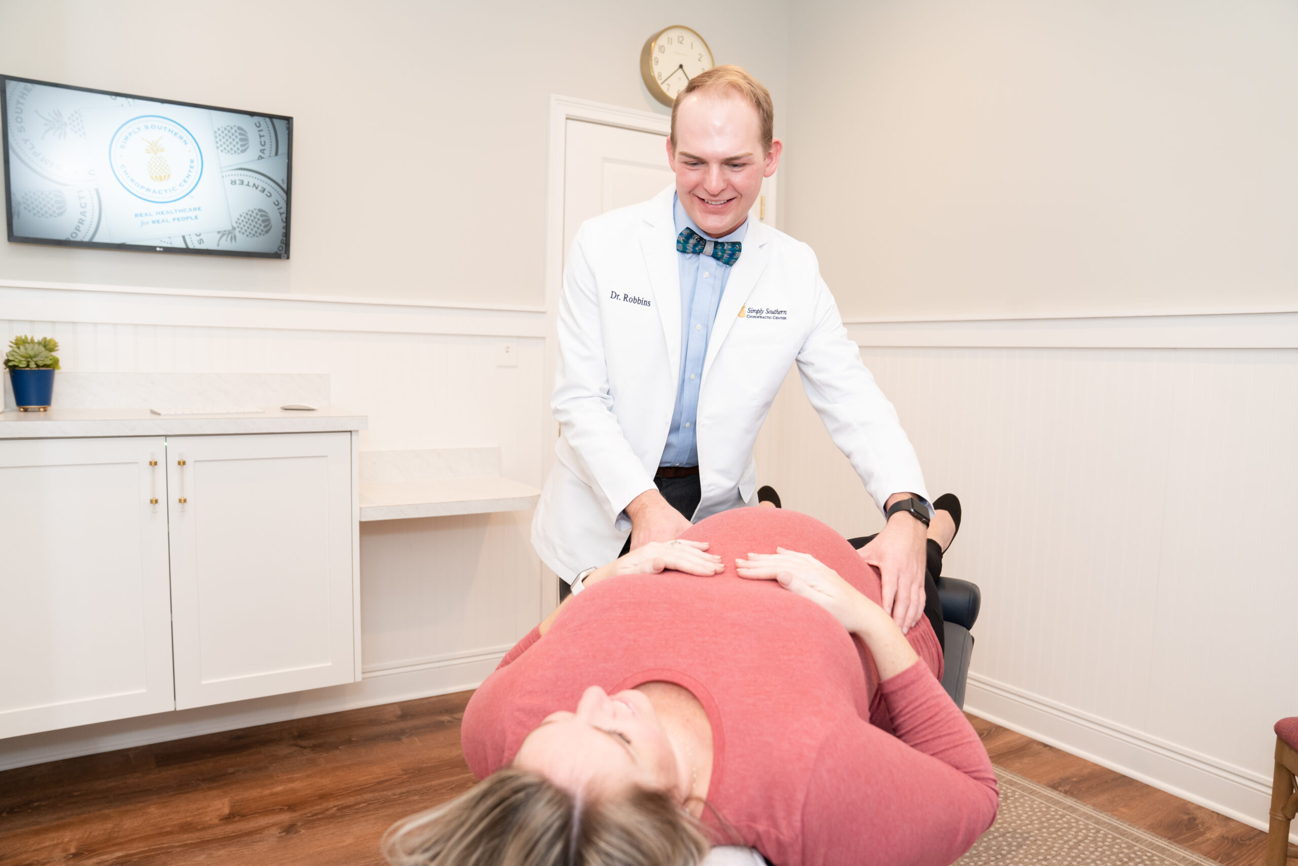 Dr. Robbins performing adjustment on pregnant patient