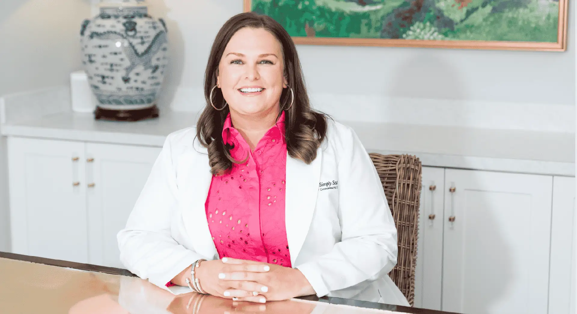 Photograph of Dr. Duncan seated at a desk in a clean, professional environment.